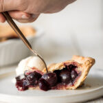 Summery and fruity, classic cherry pie has the most flakey and buttery pie crust on the bottom and top and is filled with a delicious cherry-packed filling. | aheadofthyme.com