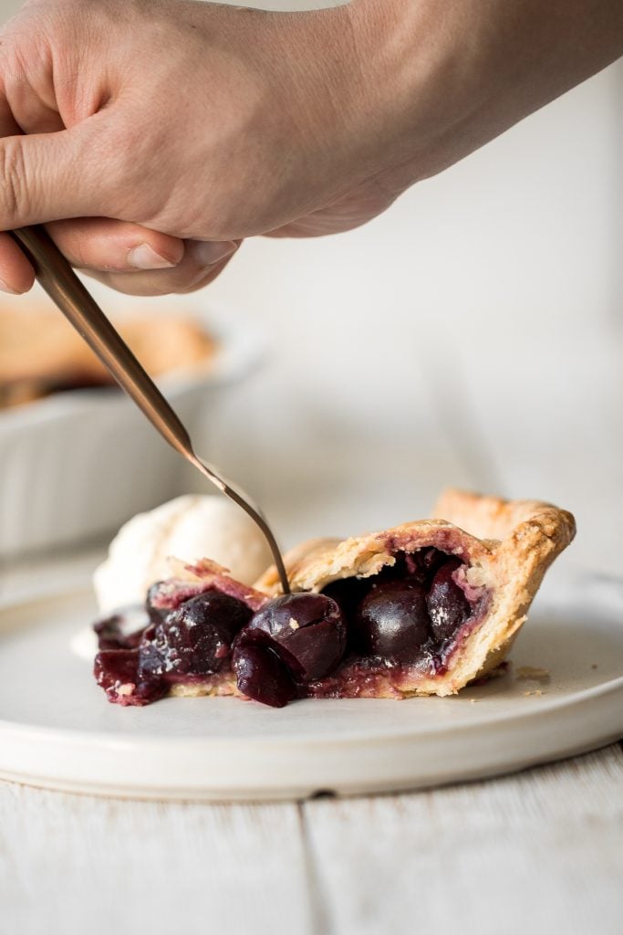 Summery and fruity, classic cherry pie has the most flakey and buttery pie crust on the bottom and top and is filled with a delicious cherry-packed filling. | aheadofthyme.com