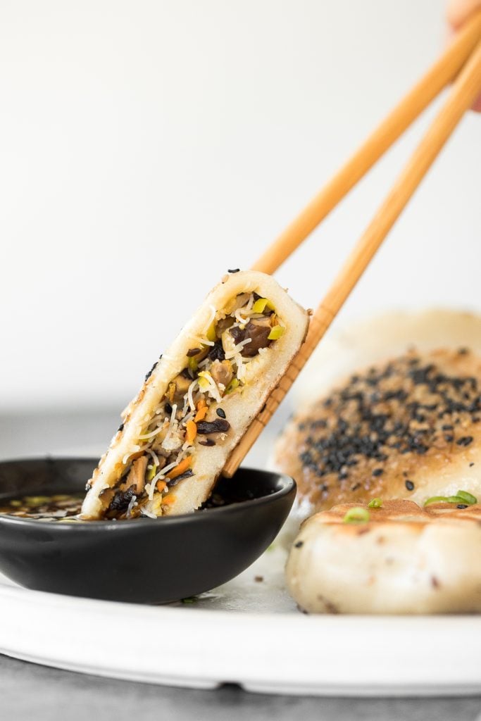 Crispy bottom pan-fried fried vegetable buns (no yeast) are crunchy outside yet tender inside with a mushroom, carrot and vermicelli vegetarian filling. | aheadofthyme.com