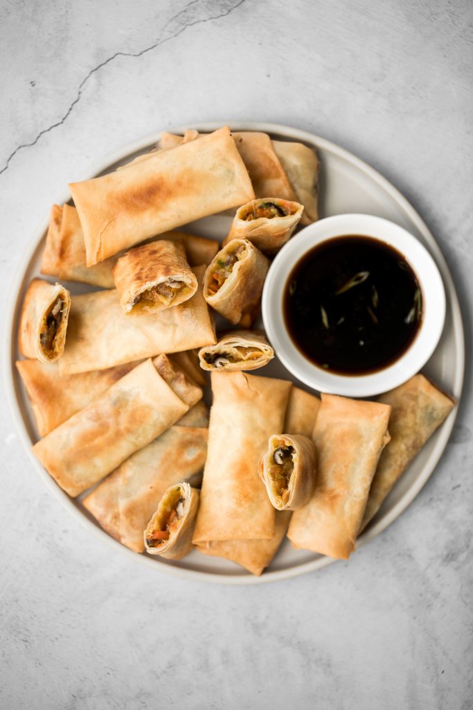 Better than takeout, light and crispy fried vegetarian spring rolls are packed with a tender mushroom and cabbage vegetarian filling in a crunchy skin. | aheadofthyme.com