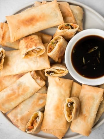 Better than takeout, light and crispy fried vegetarian spring rolls are packed with a tender mushroom and cabbage vegetarian filling in a crunchy skin. | aheadofthyme.com