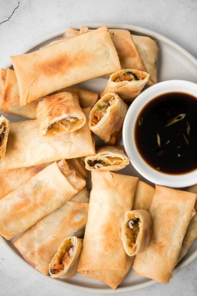 Better than takeout, light and crispy fried vegetarian spring rolls are packed with a tender mushroom and cabbage vegetarian filling in a crunchy skin. | aheadofthyme.com