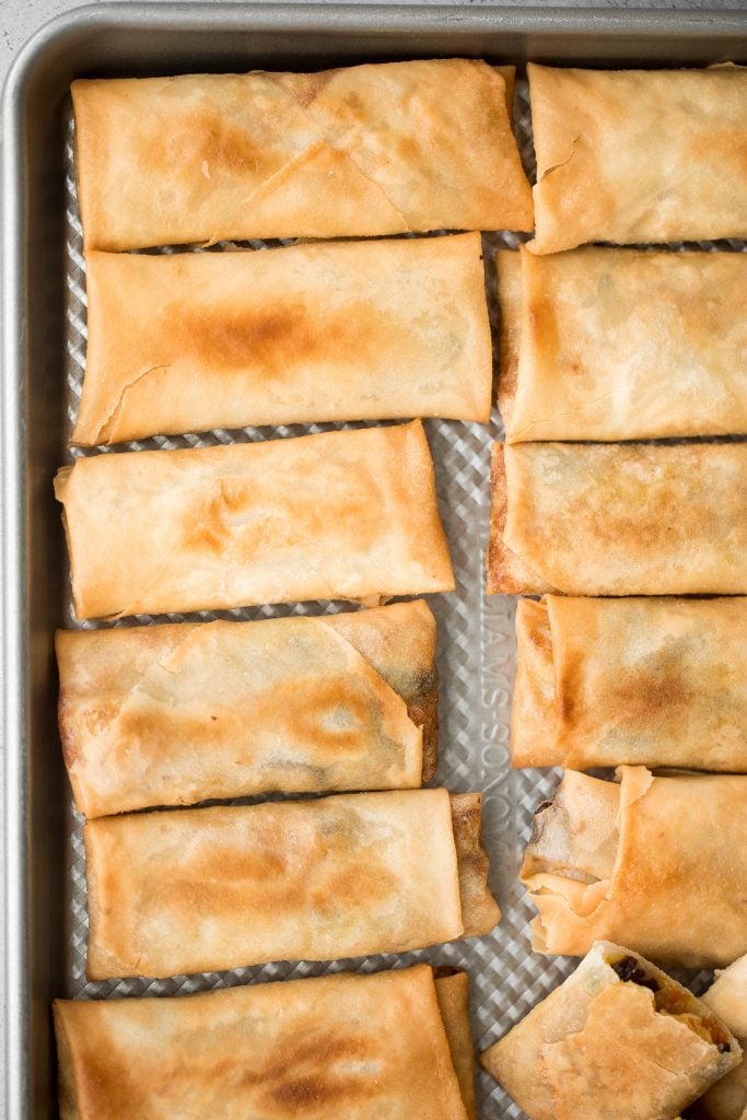 Better than takeout, light and crispy fried vegetarian spring rolls are packed with a tender mushroom and cabbage vegetarian filling in a crunchy skin. | aheadofthyme.com