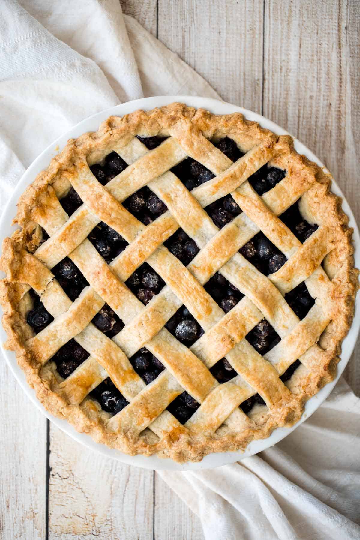 This Homemade Blueberry Pie with Lattice Top features a perfect flaky crust and jammy filling. It's a classic summer dessert made from scratch. | aheadofthyme.com