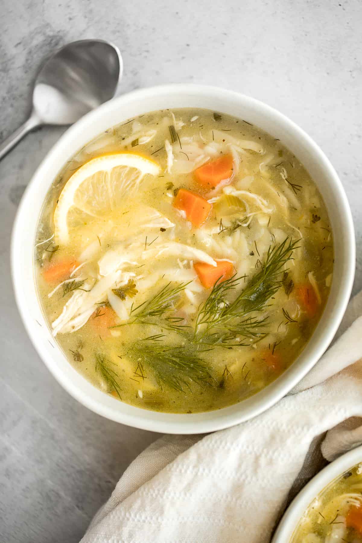 Smooth, hearty and light, one pot lemon chicken orzo soup is pure comfort in a bowl. This family favourite is like chicken noodle soup with a major upgrade. | aheadofthyme.com