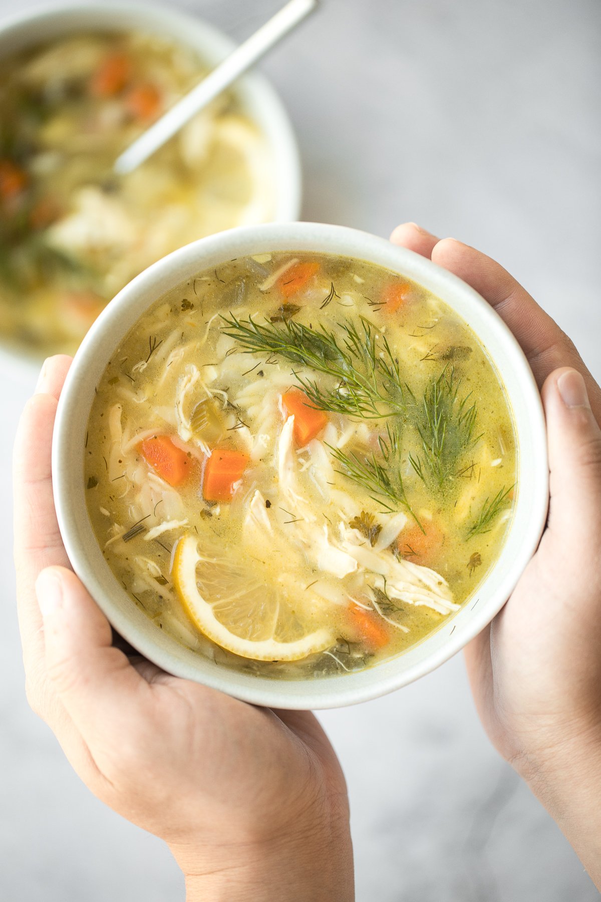 Smooth, hearty and light, one pot lemon chicken orzo soup is pure comfort in a bowl. This family favourite is like chicken noodle soup with a major upgrade. | aheadofthyme.com