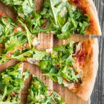 Easy and delicious homemade mushroom and arugula skillet pizza with a perfectly crispy pizza crust is topped with mushrooms, arugula, and mozzarella cheese. | aheadofthyme.com