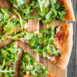Easy and delicious homemade mushroom and arugula skillet pizza with a perfectly crispy pizza crust is topped with mushrooms, arugula, and mozzarella cheese. | aheadofthyme.com