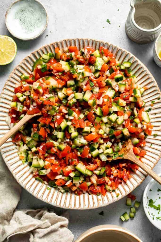 Persian Shirazi Salad with cucumber and tomato is a healthy, light, and simple salad packed with herbs and tossed in an olive oil lime dressing. | aheadofthyme.com