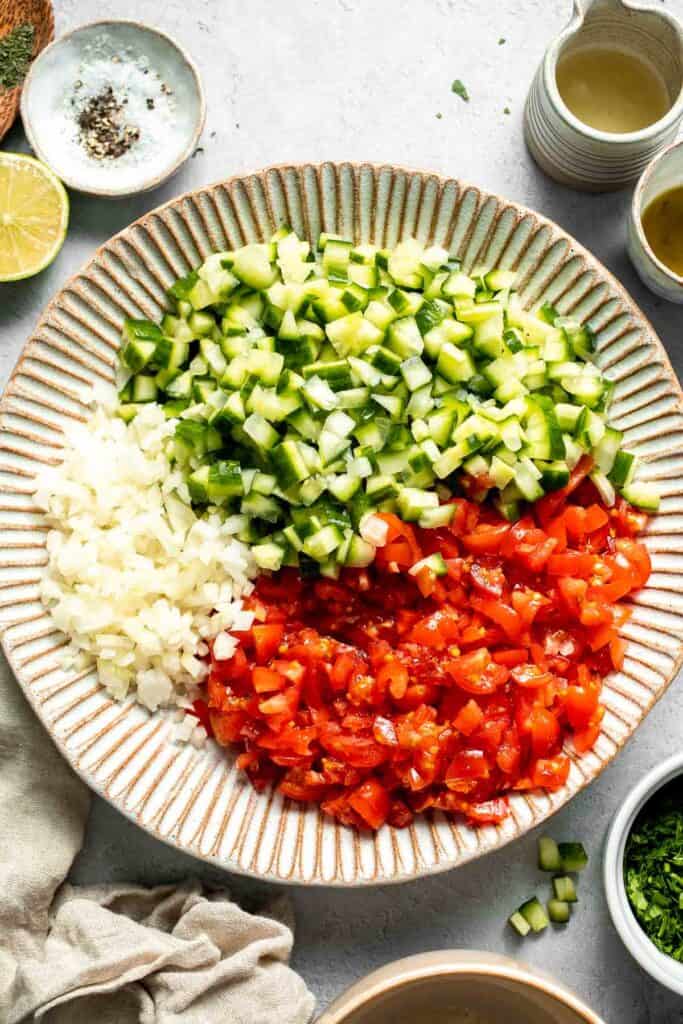 Persian Shirazi Salad with cucumber and tomato is a healthy, light, and simple salad packed with herbs and tossed in an olive oil lime dressing. | aheadofthyme.com