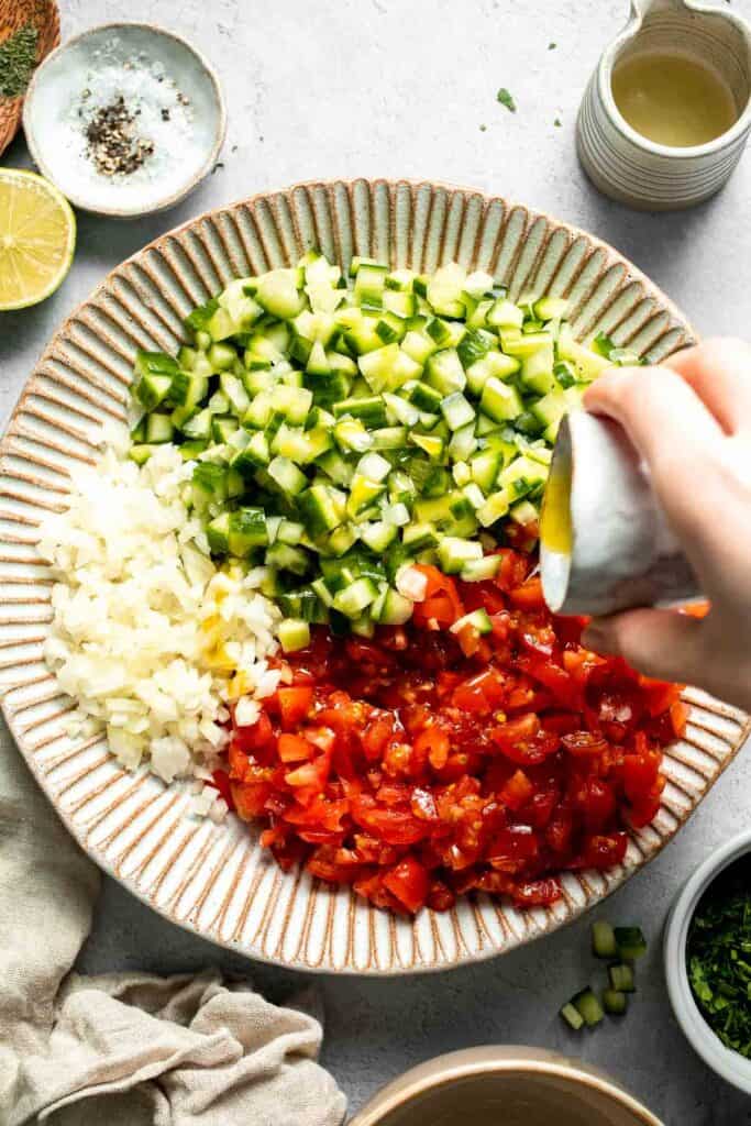 Persian Shirazi Salad with cucumber and tomato is a healthy, light, and simple salad packed with herbs and tossed in an olive oil lime dressing. | aheadofthyme.com