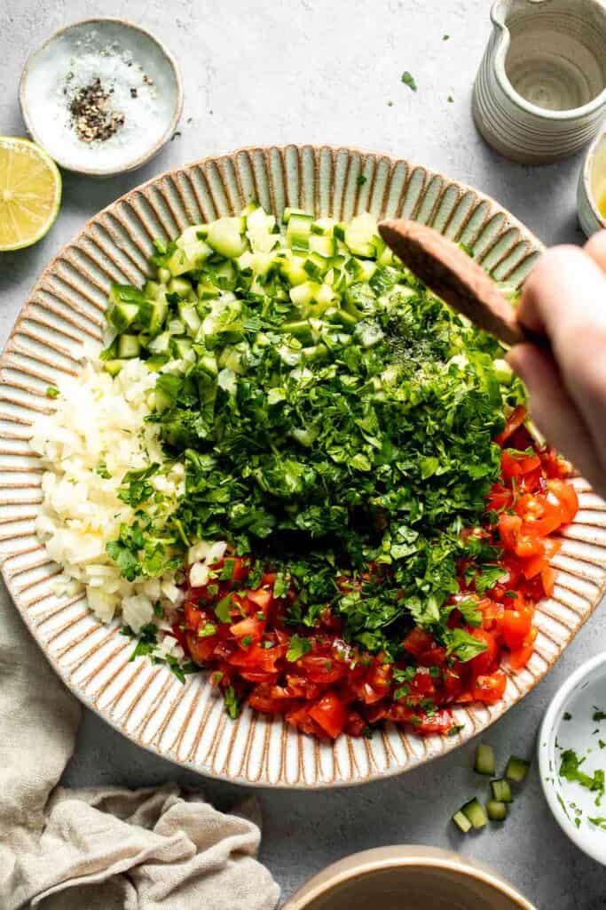 Persian Shirazi Salad with cucumber and tomato is a healthy, light, and simple salad packed with herbs and tossed in an olive oil lime dressing. | aheadofthyme.com