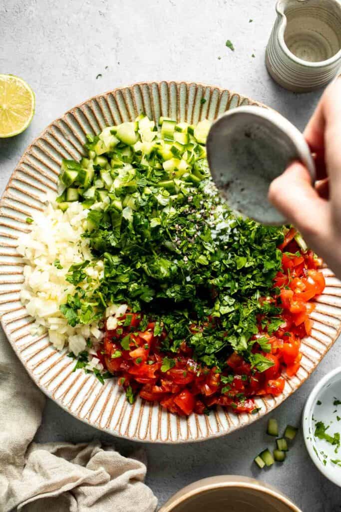 Persian Shirazi Salad with cucumber and tomato is a healthy, light, and simple salad packed with herbs and tossed in an olive oil lime dressing. | aheadofthyme.com