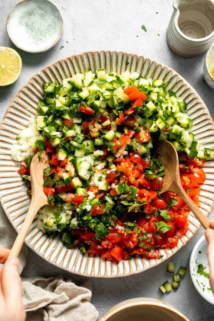 Persian Shirazi Salad with cucumber and tomato is a healthy, light, and simple salad packed with herbs and tossed in an olive oil lime dressing. | aheadofthyme.com