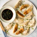 Wrinkly crispy pork and sardine dumplings (potstickers) with vinegar dipping sauce, are filled with pork, canned sardines, green onions and Asian seasoning. | aheadofthyme.com
