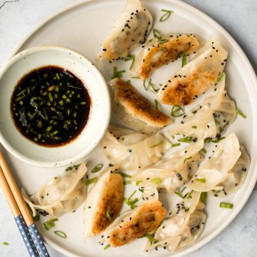 Wrinkly crispy pork and sardine dumplings (potstickers) with vinegar dipping sauce, are filled with pork, canned sardines, green onions and Asian seasoning. | aheadofthyme.com