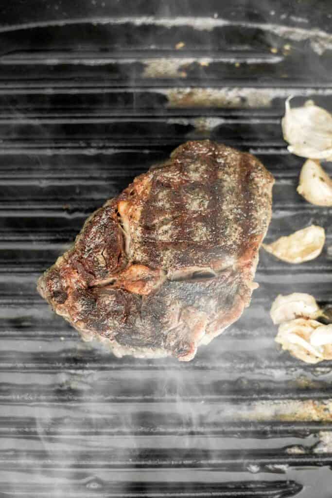 Better than the steakhouse, the best tender and juicy Ribeye Steak with a perfect seared crust is garlicky, buttery and packed with so much flavour. | aheadofthyme.com