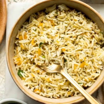 One pot Rice Pilaf with Carrots is quick, easy, and loaded with flavor. Cook this vegetable rice on the stove, rice cooker, or instant pot. | aheadofthyme.com
