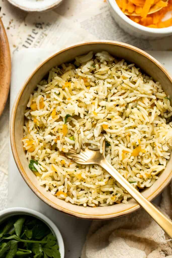 One pot Rice Pilaf with Carrots is quick, easy, and loaded with flavor. Cook this vegetable rice on the stove, rice cooker, or instant pot. | aheadofthyme.com