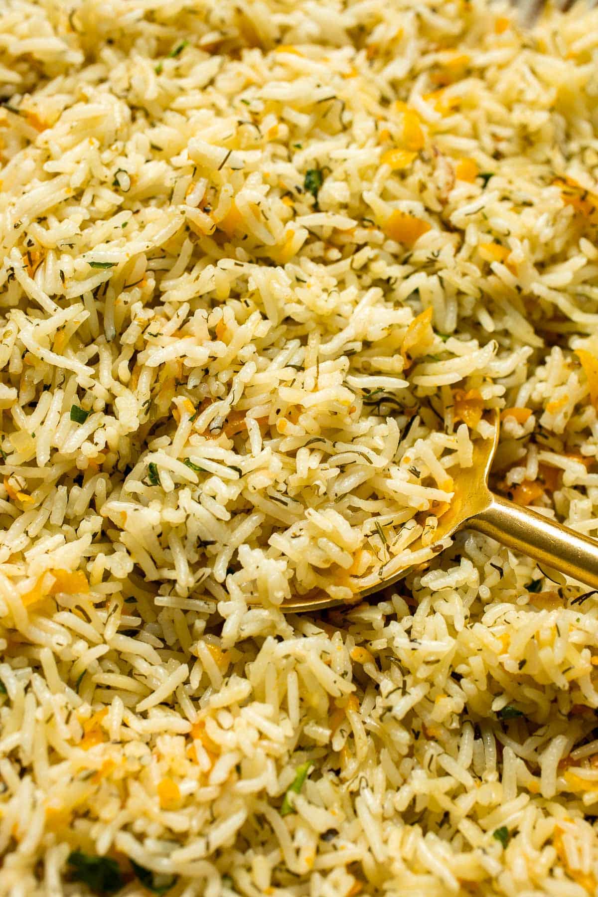 One pot Rice Pilaf with Carrots is quick, easy, and loaded with flavor. Cook this vegetable rice on the stove, rice cooker, or instant pot. | aheadofthyme.com