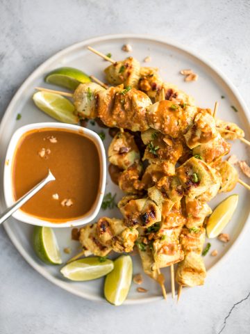 Better than takeout, easy to make tender chicken satay skewers with coconut marinade and homemade peanut dipping sauce is savoury, sweet, tangy, and nutty. | aheadofthyme.com