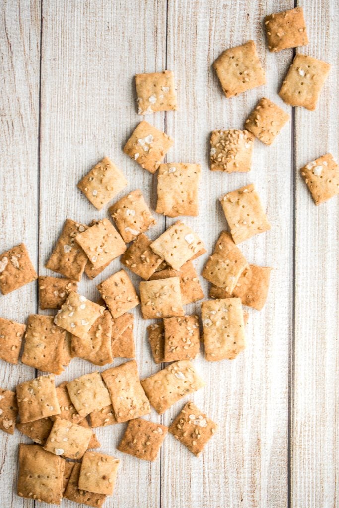 Quick and easy sourdough discard crackers are thin, crispy, crunchy and flavoured with sesame seeds, dried herbs and flaked salt. They are so addictive. | aheadofthyme.com