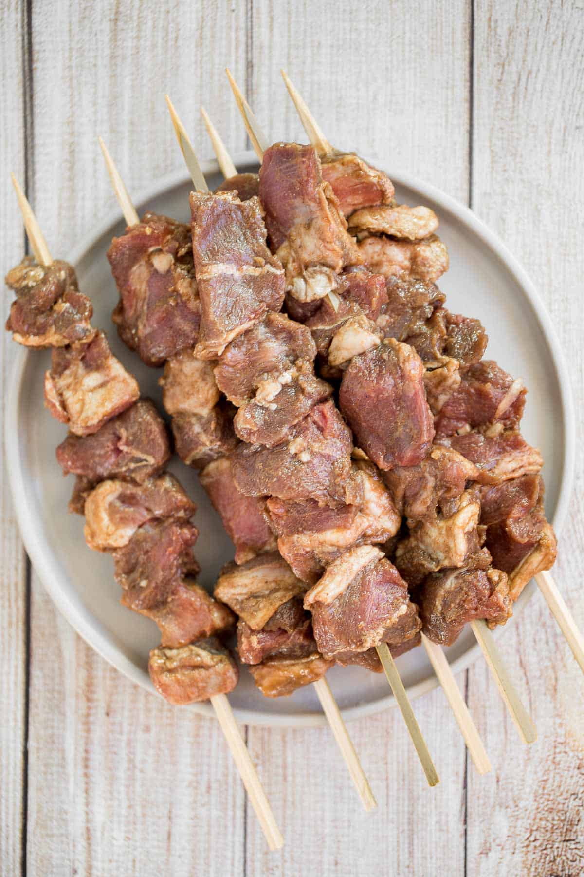 Juicy and tender, Xinjiang Spicy Cumin Lamb Skewers with a bold cumin and cayenne marinade, are so flavourful and easy to make on the grill or air fryer. | aheadofthyme.com