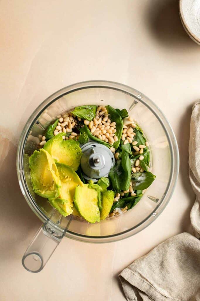 This creamy Avocado Pesto Pasta is healthy, light, and delicious. This quick and easy vegan pasta comes together in just 15 minutes (including prep!). | aheadofthyme.com