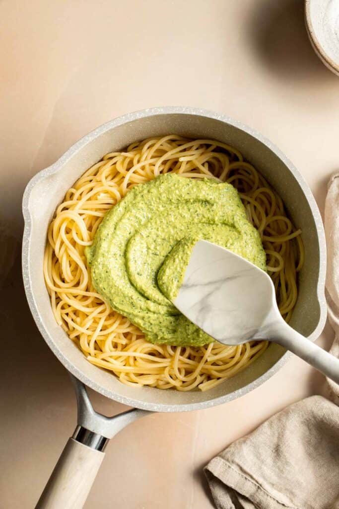 This creamy Avocado Pesto Pasta is healthy, light, and delicious. This quick and easy vegan pasta comes together in just 15 minutes (including prep!). | aheadofthyme.com