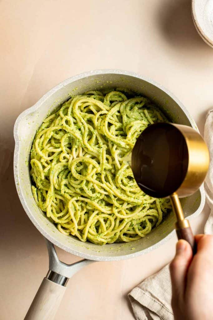 This creamy Avocado Pesto Pasta is healthy, light, and delicious. This quick and easy vegan pasta comes together in just 15 minutes (including prep!). | aheadofthyme.com