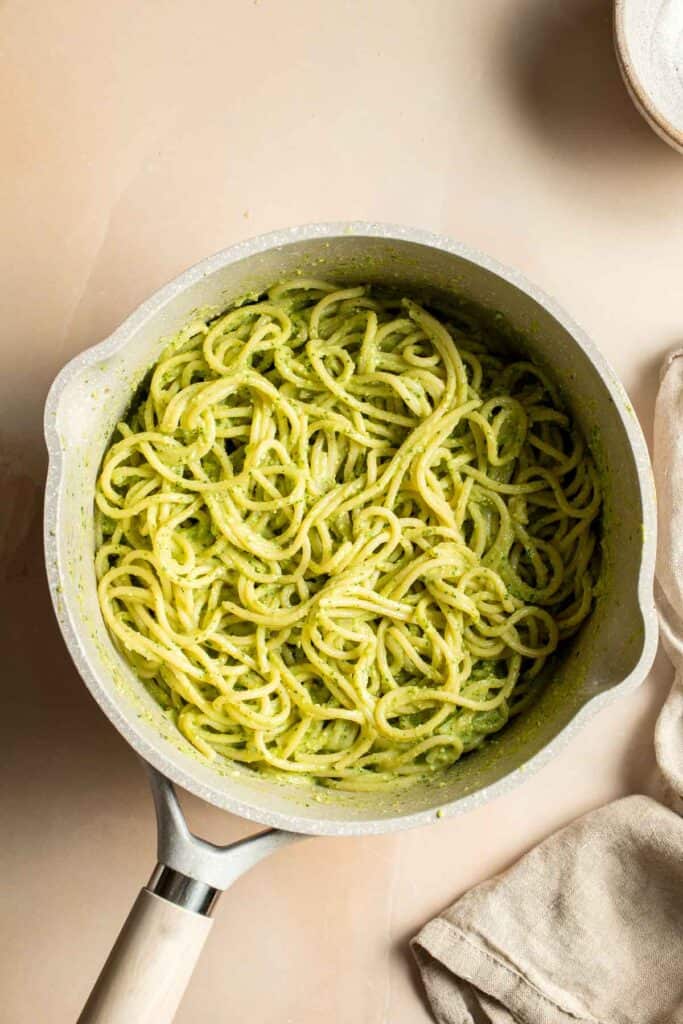 This creamy Avocado Pesto Pasta is healthy, light, and delicious. This quick and easy vegan pasta comes together in just 15 minutes (including prep!). | aheadofthyme.com