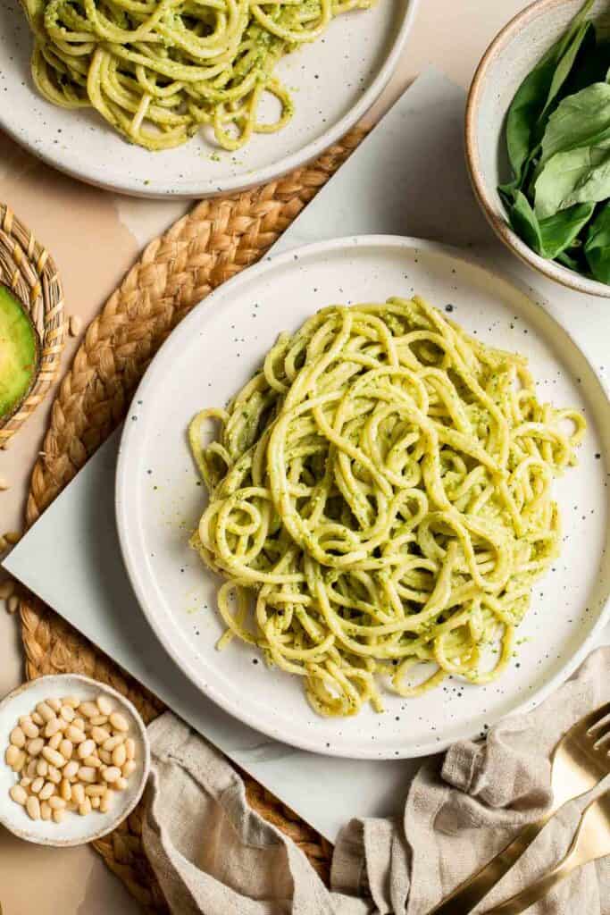 This creamy Avocado Pesto Pasta is healthy, light, and delicious. This quick and easy vegan pasta comes together in just 15 minutes (including prep!). | aheadofthyme.com