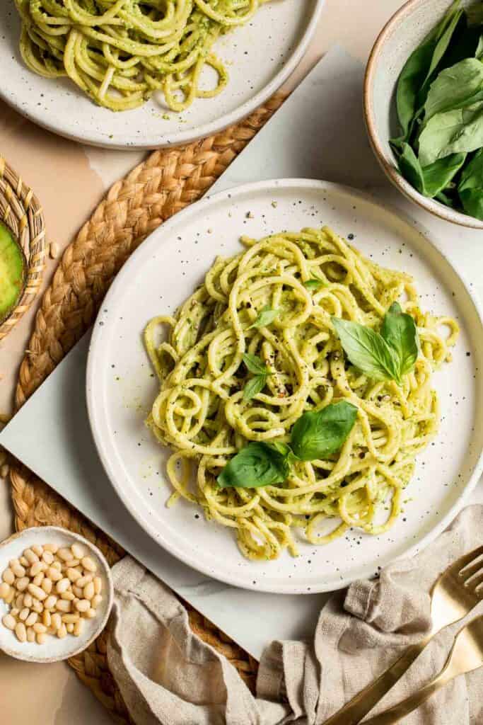 This creamy Avocado Pesto Pasta is healthy, light, and delicious. This quick and easy vegan pasta comes together in just 15 minutes (including prep!). | aheadofthyme.com