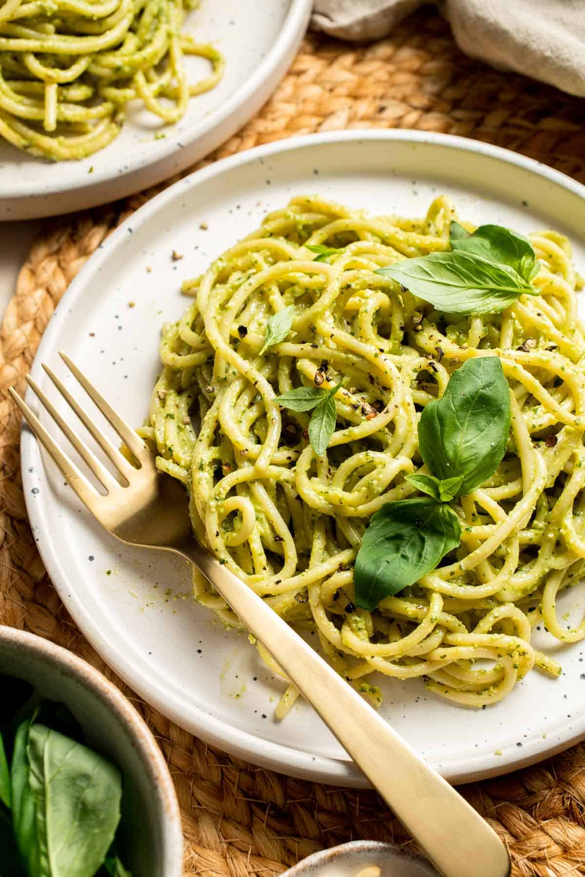 This creamy Avocado Pesto Pasta is healthy, light, and delicious. This quick and easy vegan pasta comes together in just 15 minutes (including prep!). | aheadofthyme.com