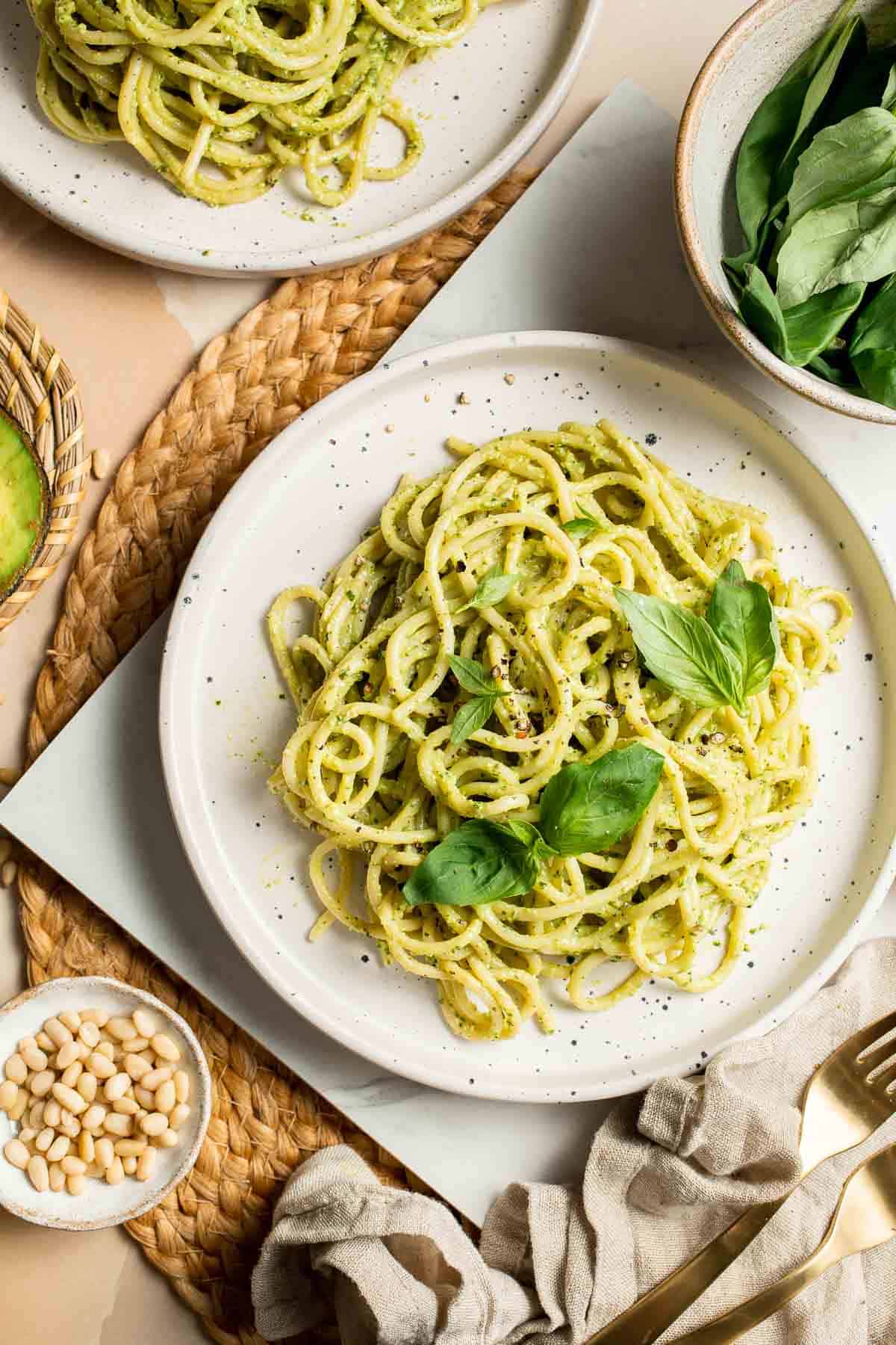 This creamy Avocado Pesto Pasta is healthy, light, and delicious. This quick and easy vegan pasta comes together in just 15 minutes (including prep!). | aheadofthyme.com