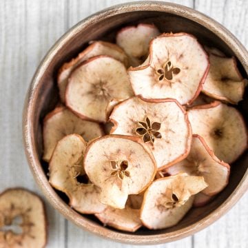 One-ingredient homemade baked apple chips are healthy, light, crispy and so addictive. They contain no added sugar and are so easy to make at home. | aheadofthyme.com