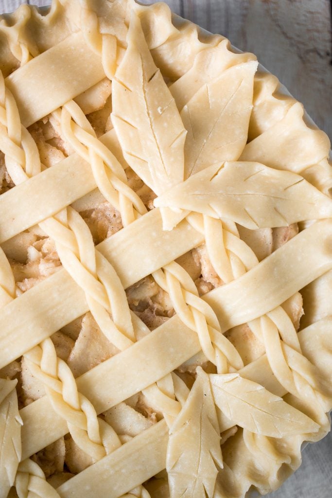 This braided lattice apple pie is packed with cinnamon apples tossed in a caramel sauce and sealed in a buttery, flaky pie crust with a braided lattice top. | aheadofthyme.com