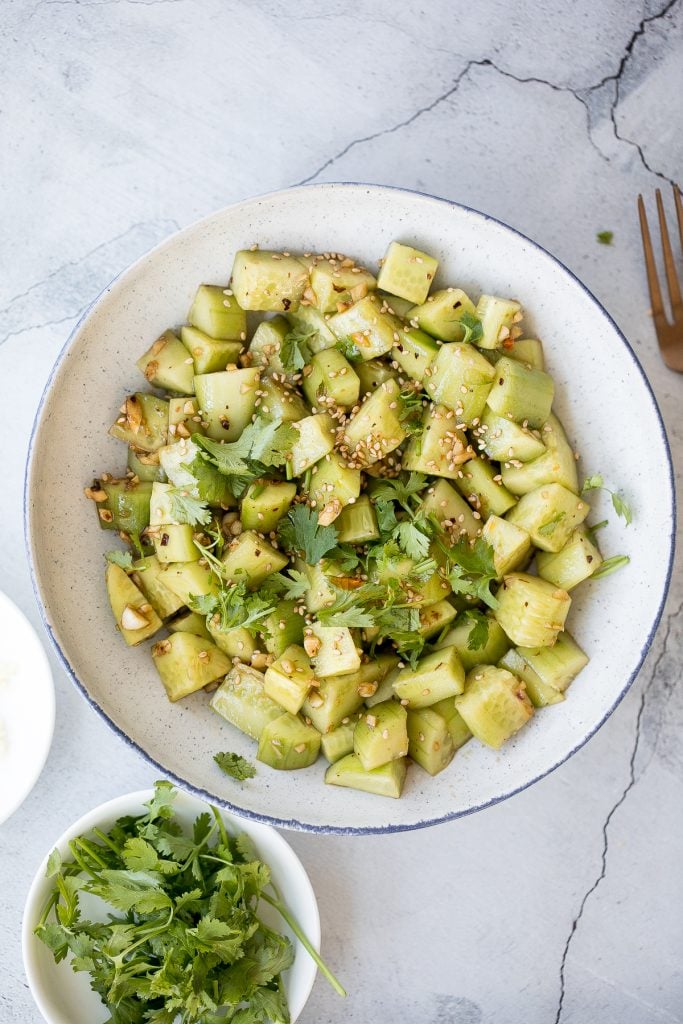 Light, refreshing and crisp Chinese garlic cucumber salad is a quick and easy, simple salad tossed in an Asian dressing and packed with a ton of flavour. | aheadofthyme.com