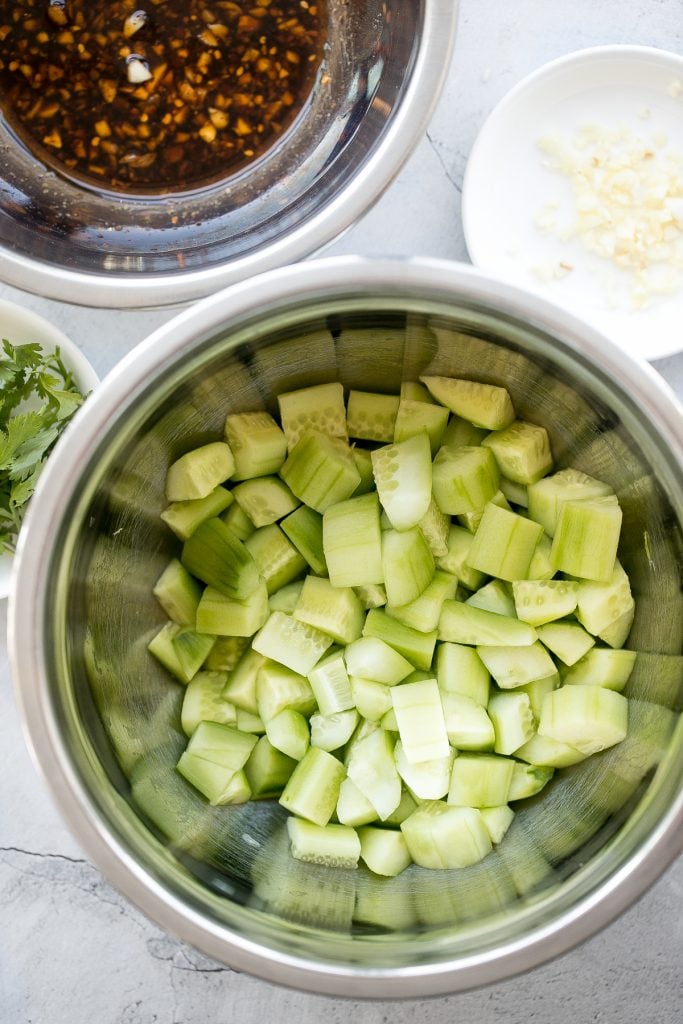 Light, refreshing and crisp Chinese garlic cucumber salad is a quick and easy, simple salad tossed in an Asian dressing and packed with a ton of flavour. | aheadofthyme.com