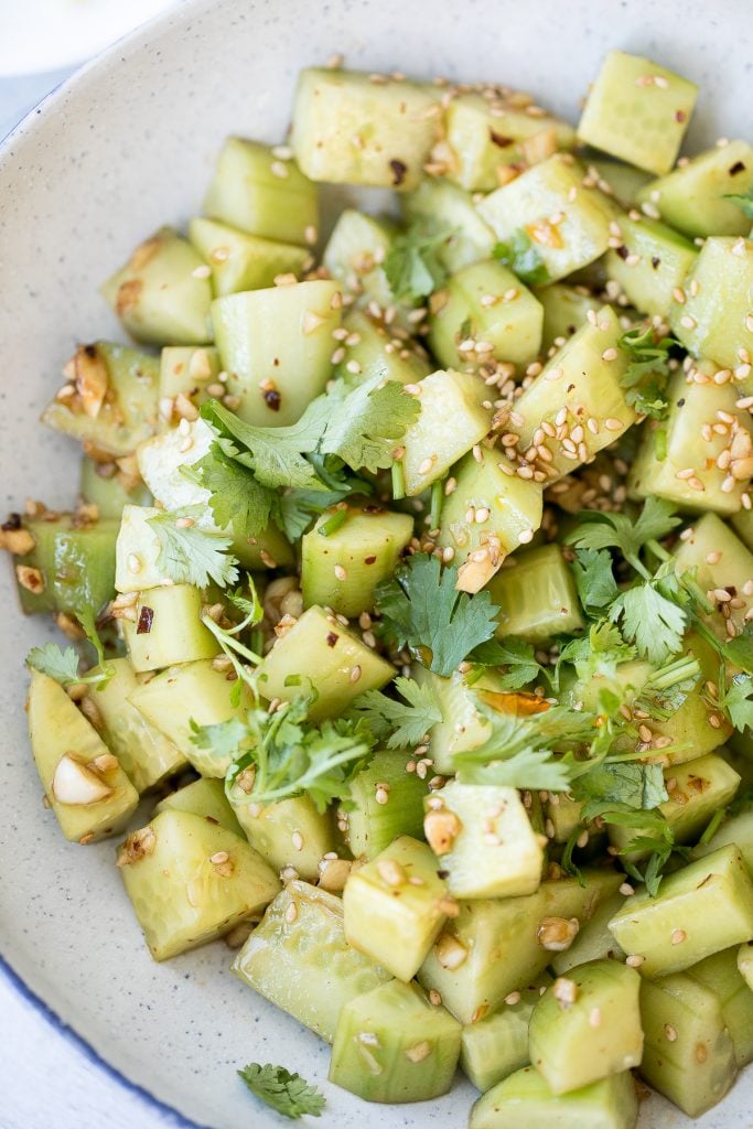 Light, refreshing and crisp Chinese garlic cucumber salad is a quick and easy, simple salad tossed in an Asian dressing and packed with a ton of flavour. | aheadofthyme.com