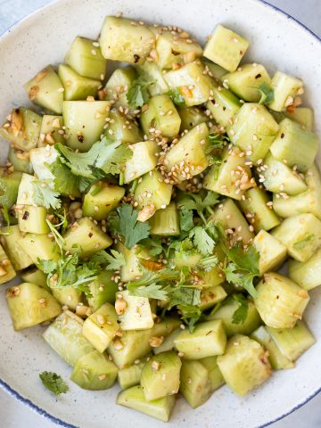 Light, refreshing and crisp Chinese garlic cucumber salad is a quick and easy, simple salad tossed in an Asian dressing and packed with a ton of flavour. | aheadofthyme.com