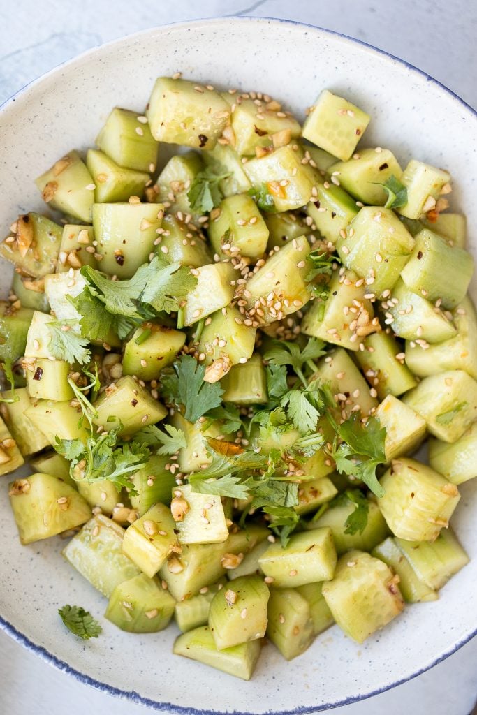 Light, refreshing and crisp Chinese garlic cucumber salad is a quick and easy, simple salad tossed in an Asian dressing and packed with a ton of flavour. | aheadofthyme.com