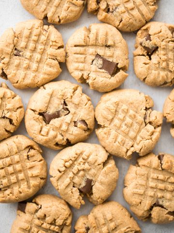 These perfectly soft, chewy and a little crumby chocolate chunk peanut butter cookies literally melts in your mouth. Make them in under 20 minutes. | aheadofthyme.com