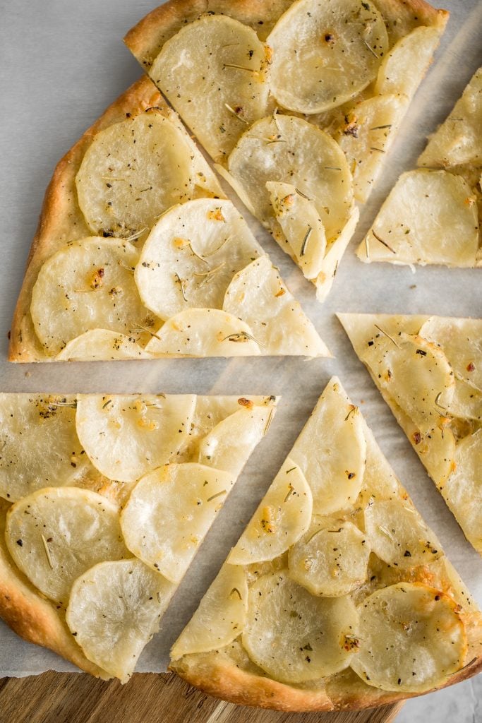 Easy and simple yet flavourful classic Roman herbed potato pizza has a crispy thin crust with layers of tender potato tossed in olive oil and herbs. | aheadofthyme.com