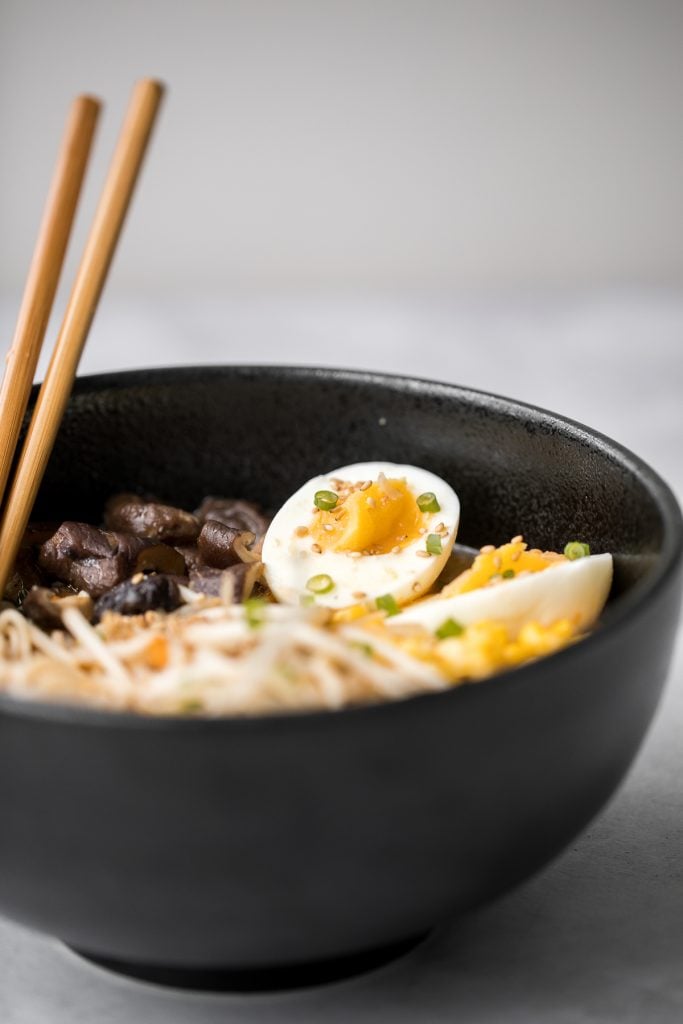 Vegetarian peanut miso ramen with a creamy vegan soup base, is topped with noodles, vegetables, and a perfect soft-boiled egg. Make it in just 20 minutes. | aheadofthyme.com