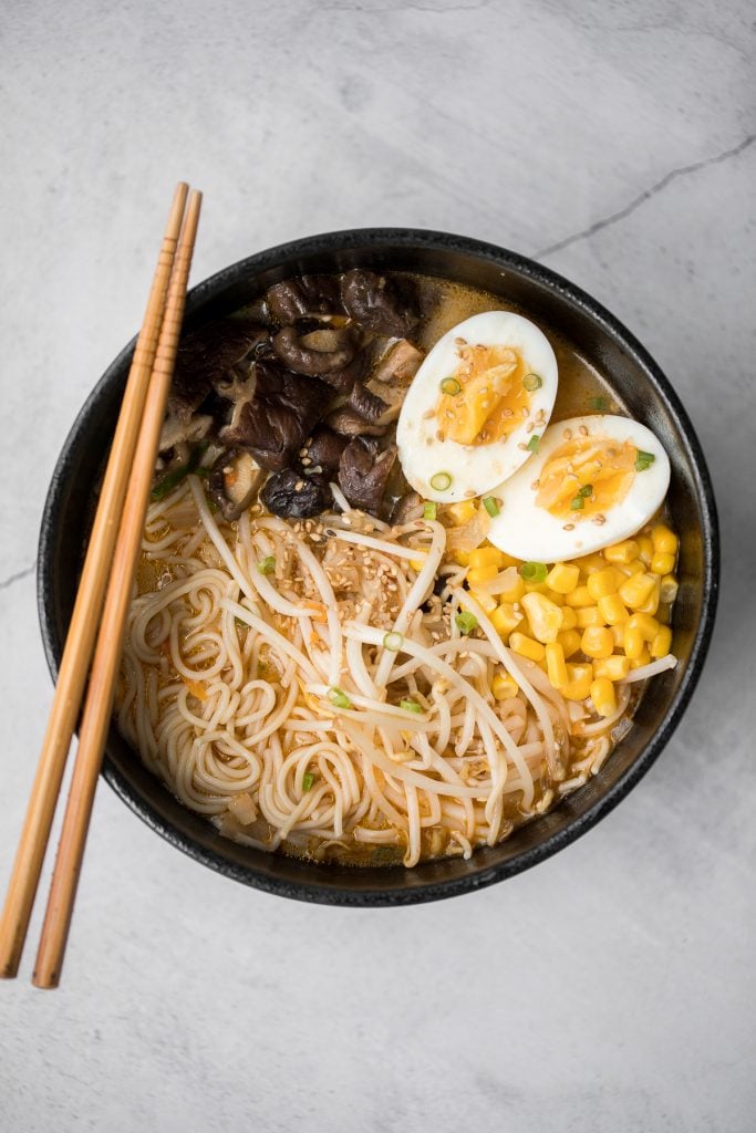 Vegetarian peanut miso ramen with a creamy vegan soup base, is topped with noodles, vegetables, and a perfect soft-boiled egg. Make it in just 20 minutes. | aheadofthyme.com