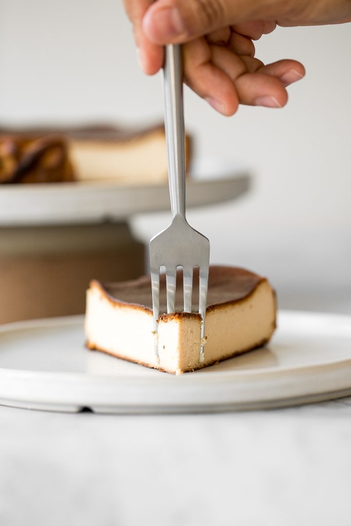 Easy no crust burnt Basque cheesecake is the easiest one bowl recipe. It is perfectly caramelized on the top and edges and creamy yet firm on the inside. | aheadofthyme.com