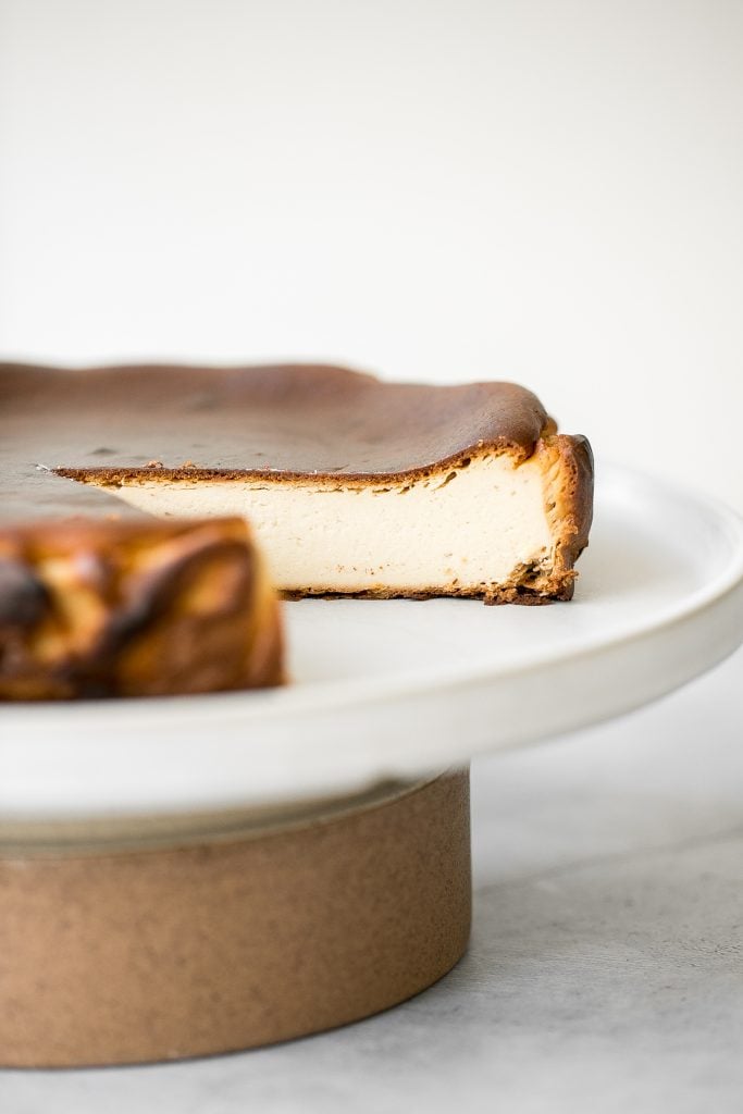 Easy no crust burnt Basque cheesecake is the easiest one bowl recipe. It is perfectly caramelized on the top and edges and creamy yet firm on the inside. | aheadofthyme.com