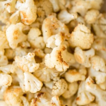 Quick and easy roasted cauliflower is a delicious, flavourful side dish that you throw on a sheet pan and into the oven. Plus, it's vegan and gluten-free. | aheadofthyme.com