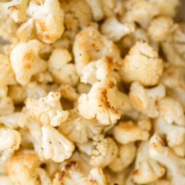 Quick and easy roasted cauliflower is a delicious, flavourful side dish that you throw on a sheet pan and into the oven. Plus, it's vegan and gluten-free. | aheadofthyme.com